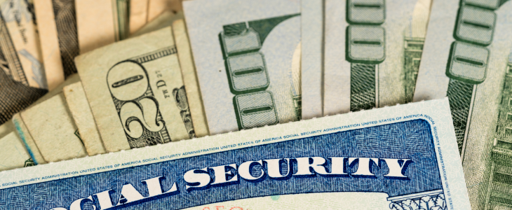 Social Security Card and money to represent unemployment fraud